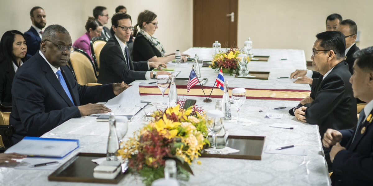 Defense ministers and Asia allies gather around a conference table at the Shangri-La Dialogue in Singapore
