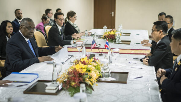 Defense ministers and Asia allies gather around a conference table at the Shangri-La Dialogue in Singapore