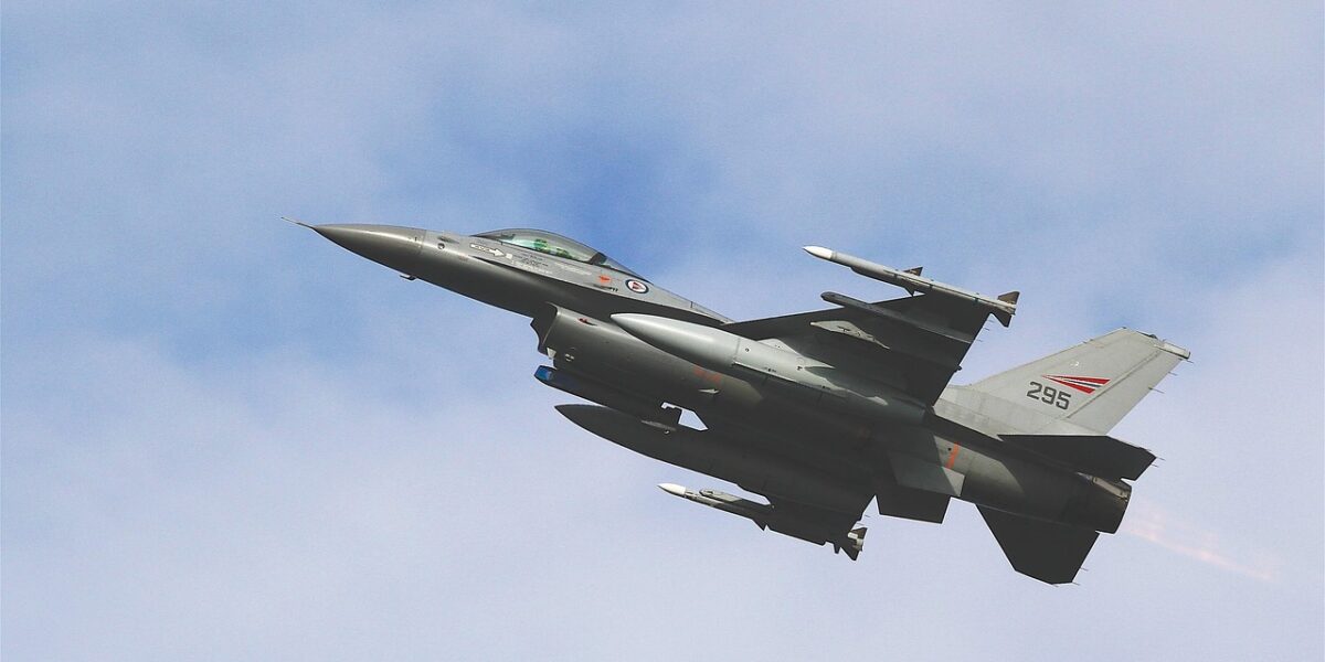 An F-16 fighter jet conducts a patrol over the Middle East, symbolizing the military tension surrounding a potential US-Iran deal.